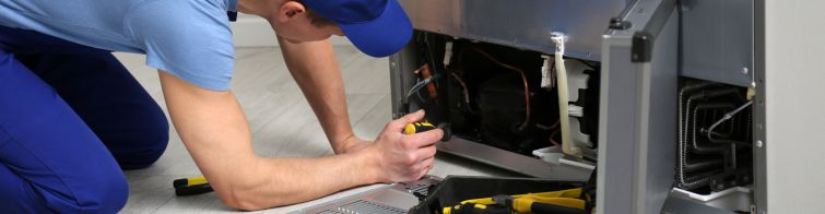 appliances expert team repairing fridge refregerator service in greater noida
