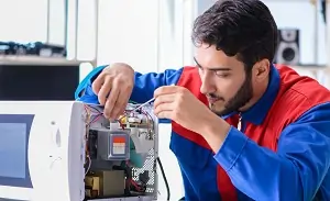appliances xpert team repairing microwave oven service in greater noida